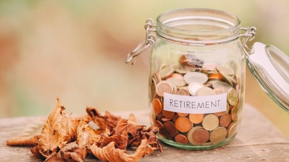 Jar containing coins with a label reading