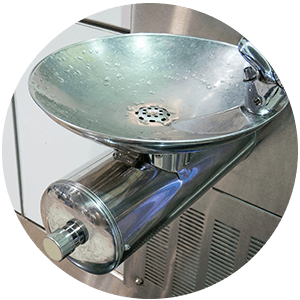 A bowl-shaped metal water fountain.