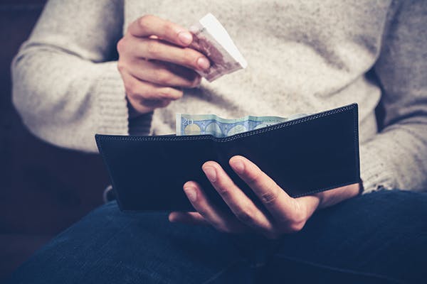 taking money out of wallet
