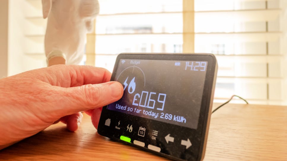 Someone checking their energy usage on their in-home device