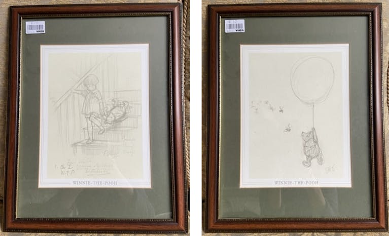 Two framed illustrations, one of Christopher Robin and one of Winnie the Pooh