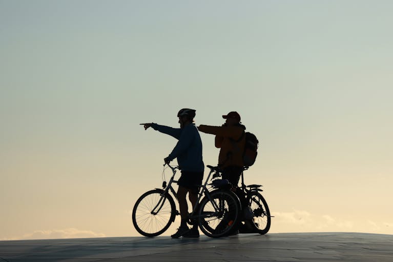 Two cyclists on a beach