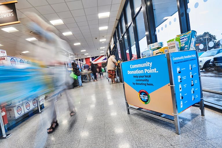 A blue and brown foodbank donation crate in an Aldi supermarket