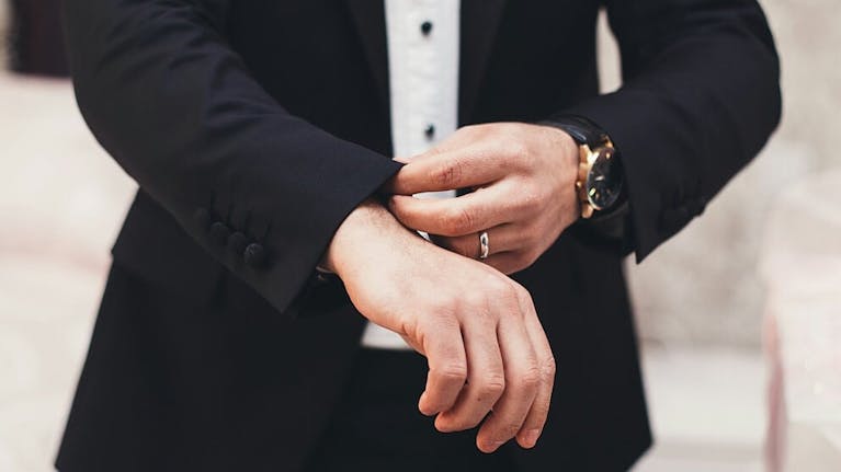 Man in black tie clothing