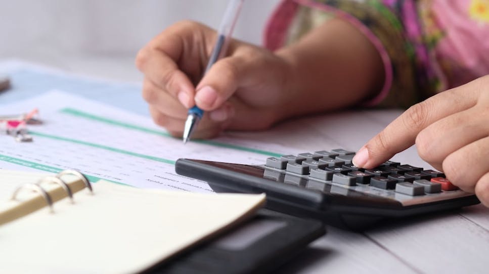 A woman using a calculator