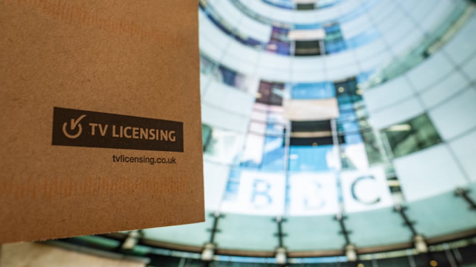 TV Licensing envelope with BBC headquarters in the background.