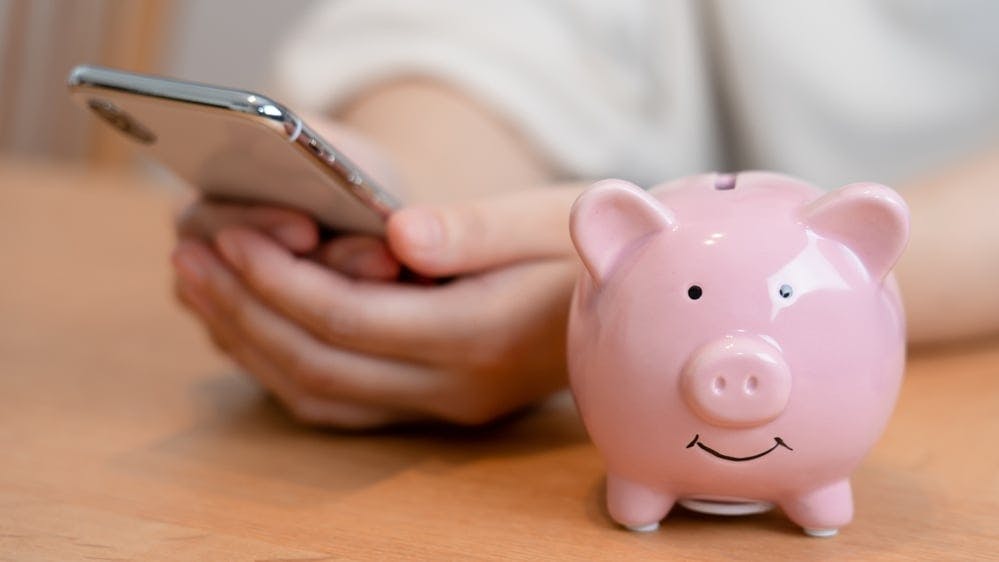 hero-homepage-tip-saving-apps-digital-banking-smartphone-mobile-phone-piggy-bank.jpg