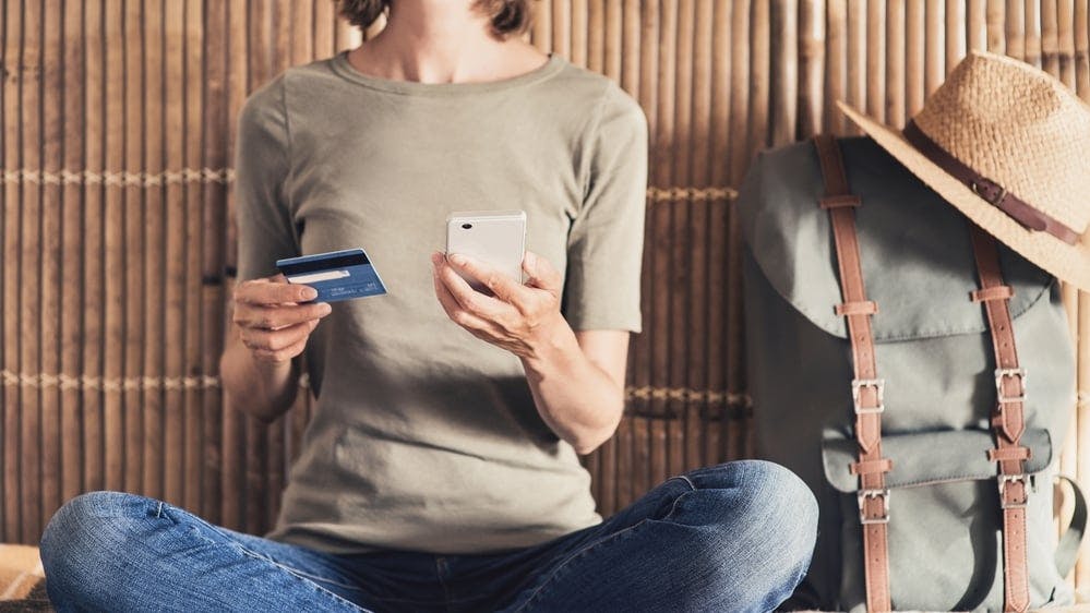 hero-homepage-woman-using-travel-credit-card.jpg