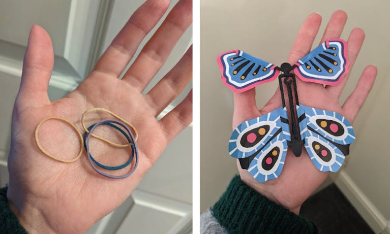 A paper butterfly and several elastic bands