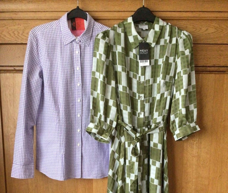 Shirt and dress on hangers