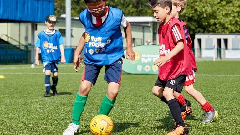 Young boys playing football