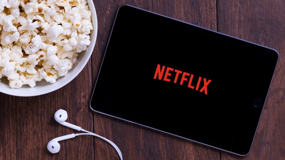 Tablet with Netflix logo on the screen.