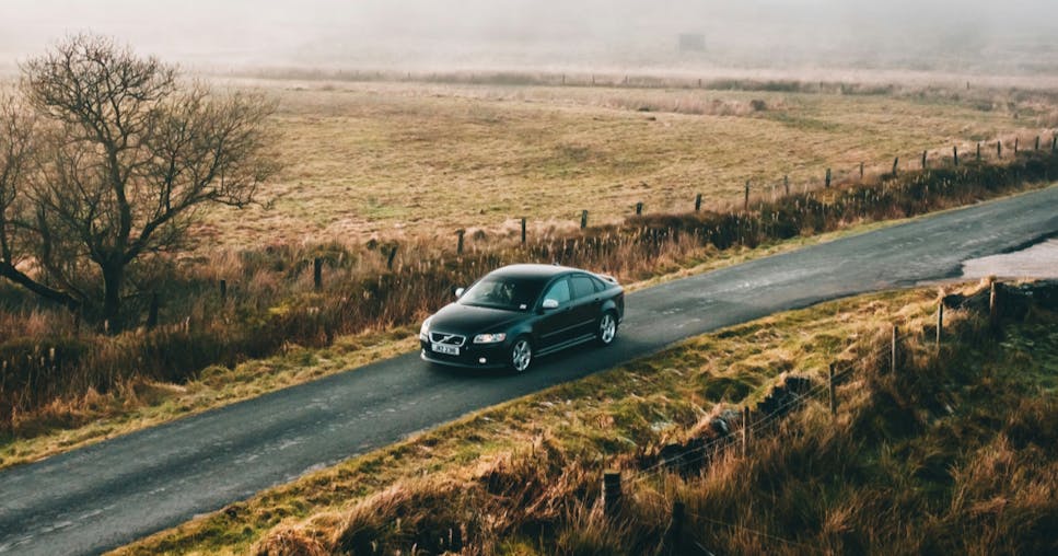 A car driving through the countryside