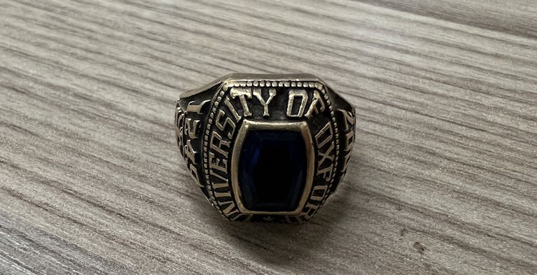 Chunky gold ring on a table