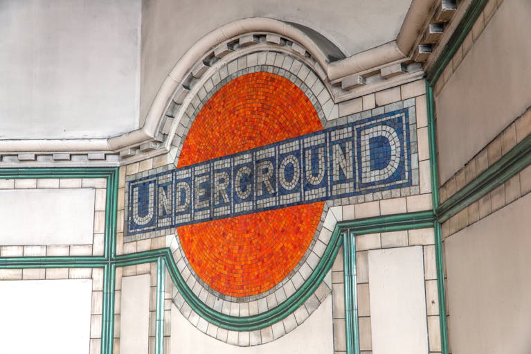 Underground roundel mosaic at Maida Vale station made up of hundreds of tiny red, white and blue tiles